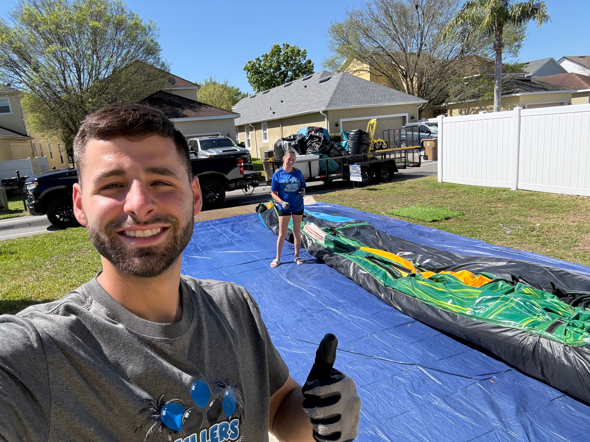 Founder of Party Rental Blueprint setting up an inflatable rental on-site
