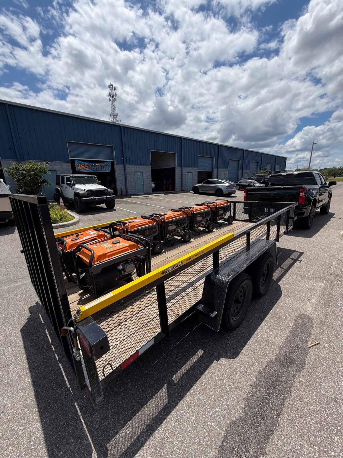Miller's Jump Time Entertainment trailer loaded with six commercial generators ready for an event.